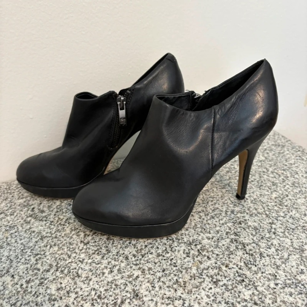 Sleek Black Leather Heeled Boots